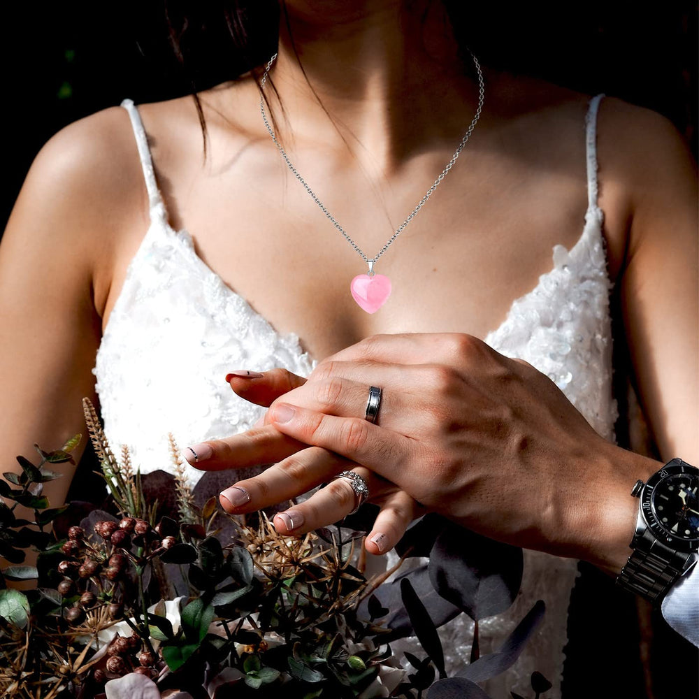 QINJIEJIE Rose Quartz heart pendant close-up highlighting smooth surface