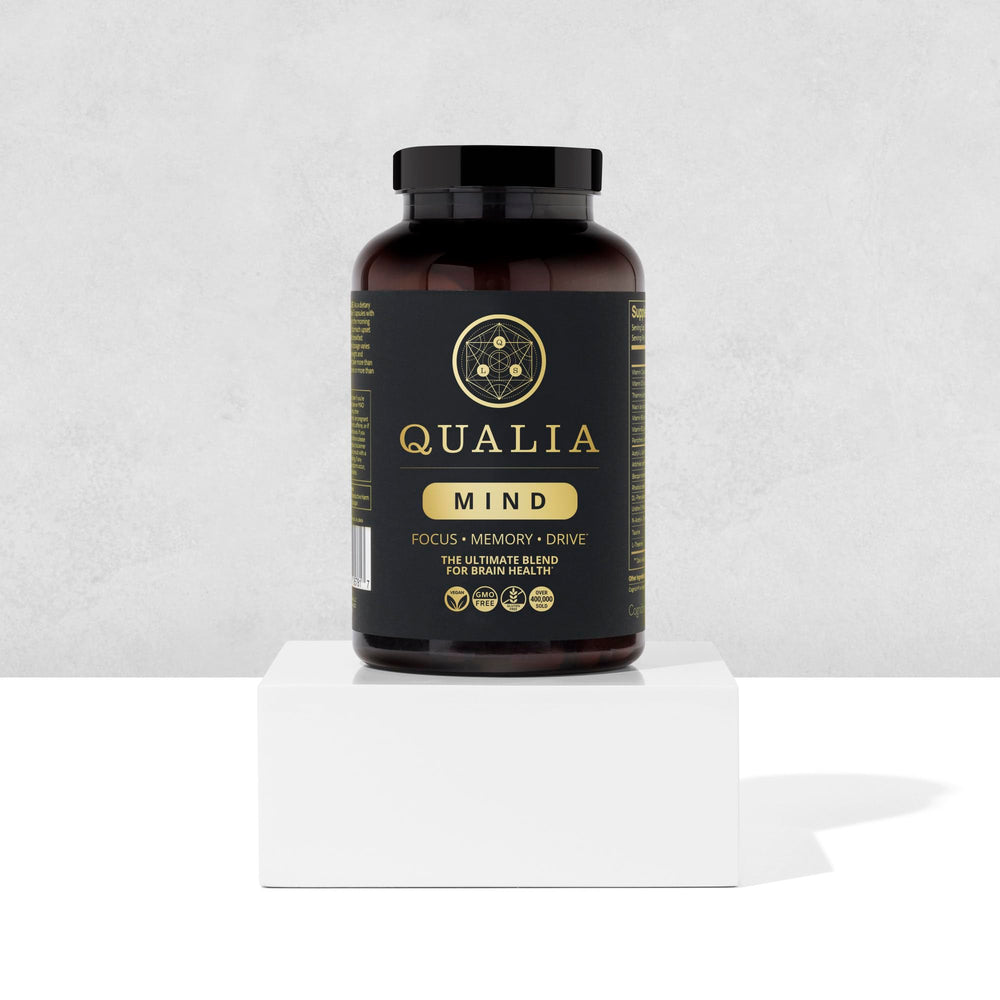 Qualia Mind vegan non-GMO badge on packaging