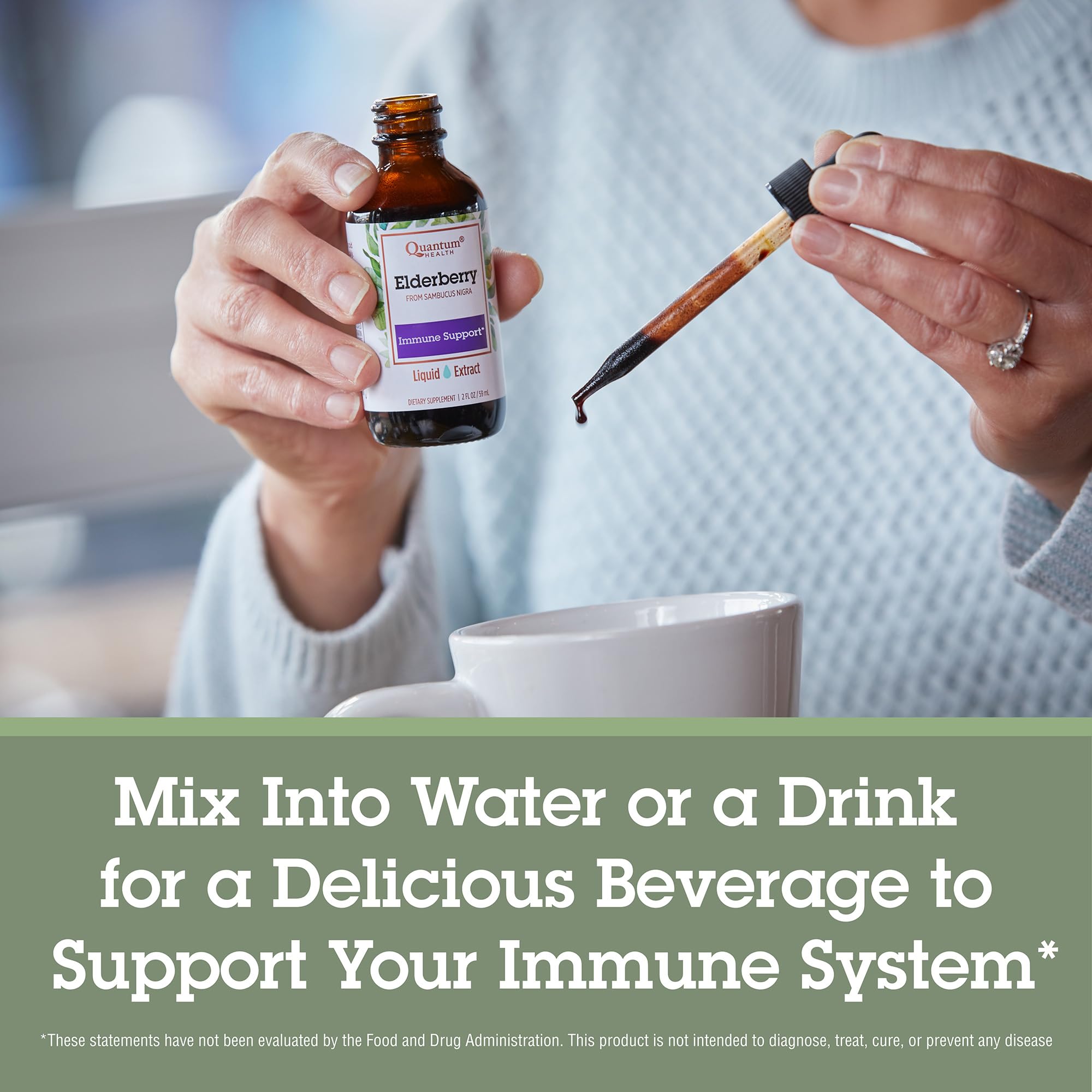Quantum Health elderberry liquid poured into glass demonstrates easy mix-in with water.