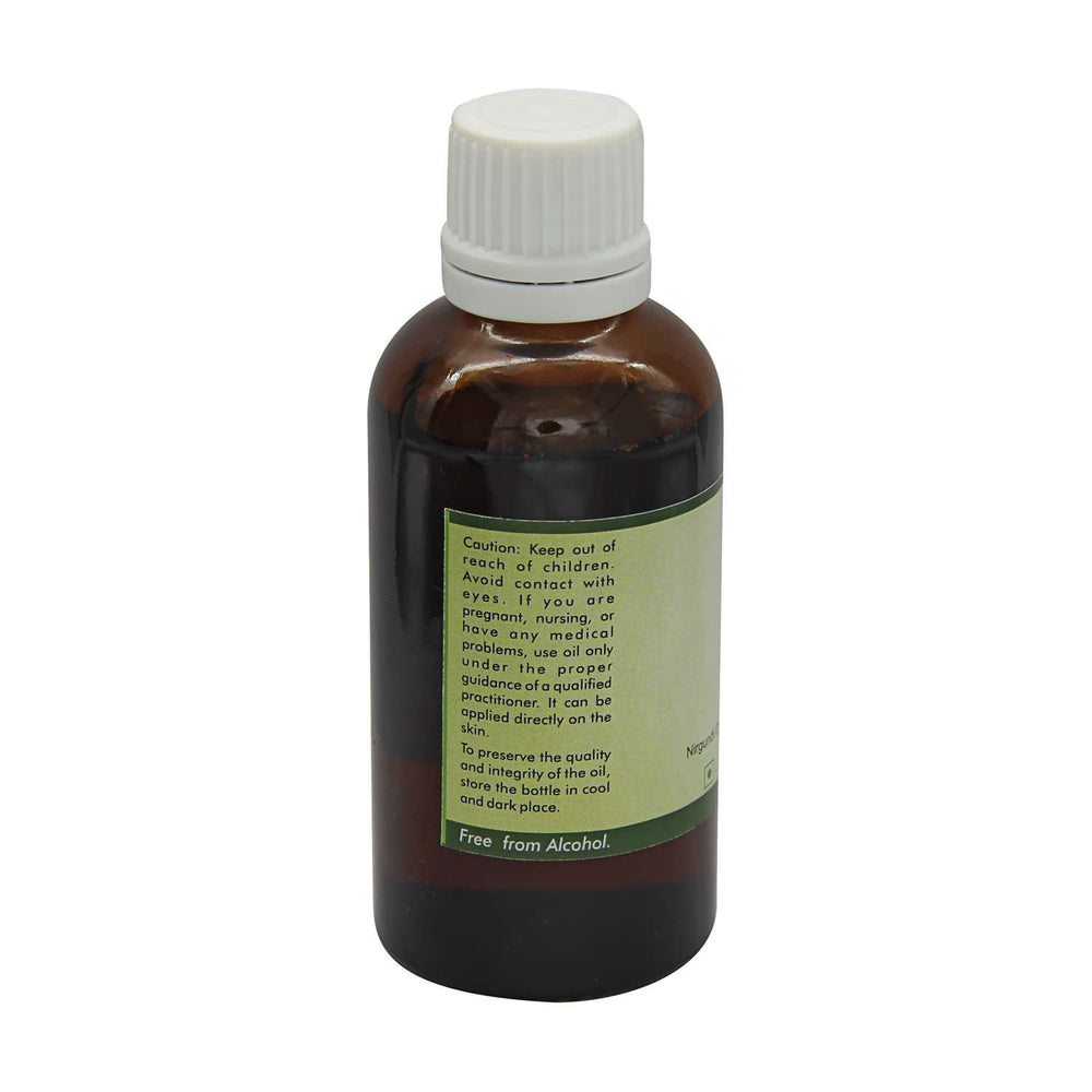 R V Essential Nirgundi oil label close-up highlighting purity and cold-pressed quality