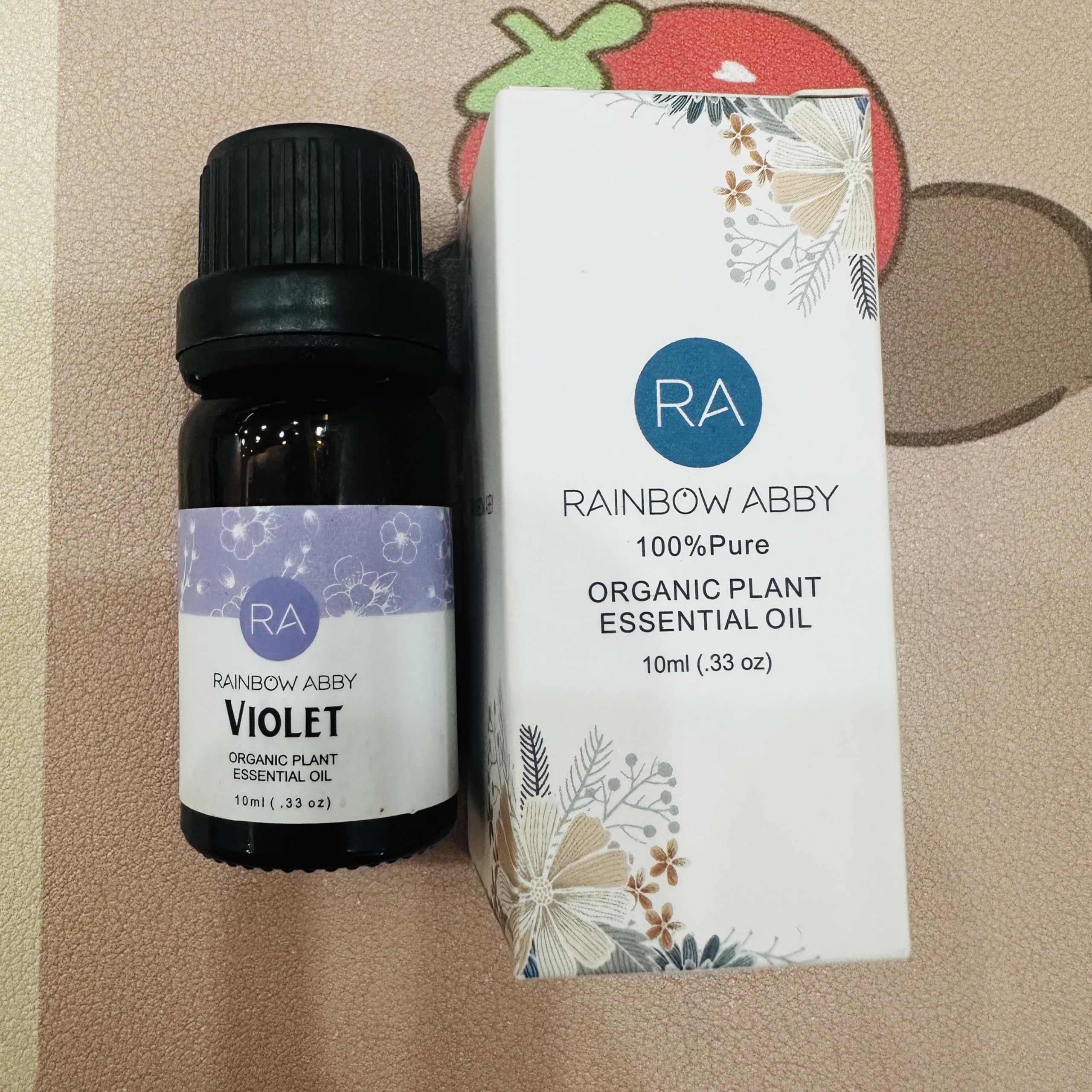 Rainbow Abby violet oil drop close-up highlighting purity and fragrance notes.