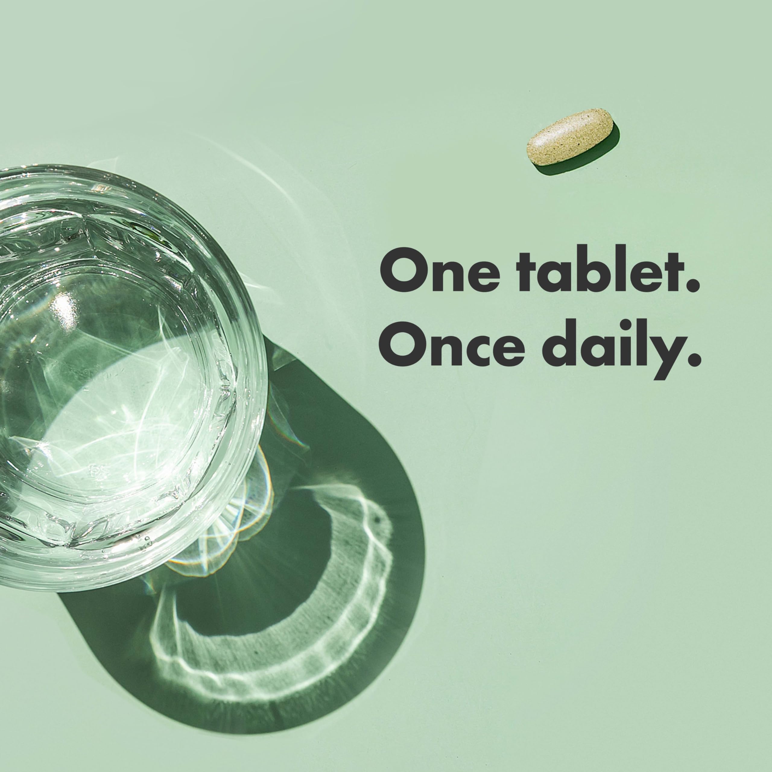 Rainbow Light Women’s One powder pouring into glass suggests quick add-to-drink convenience.
