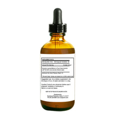 Rainforest Pharmacy Graviola dropper dispensing into beverage for easy mixing.