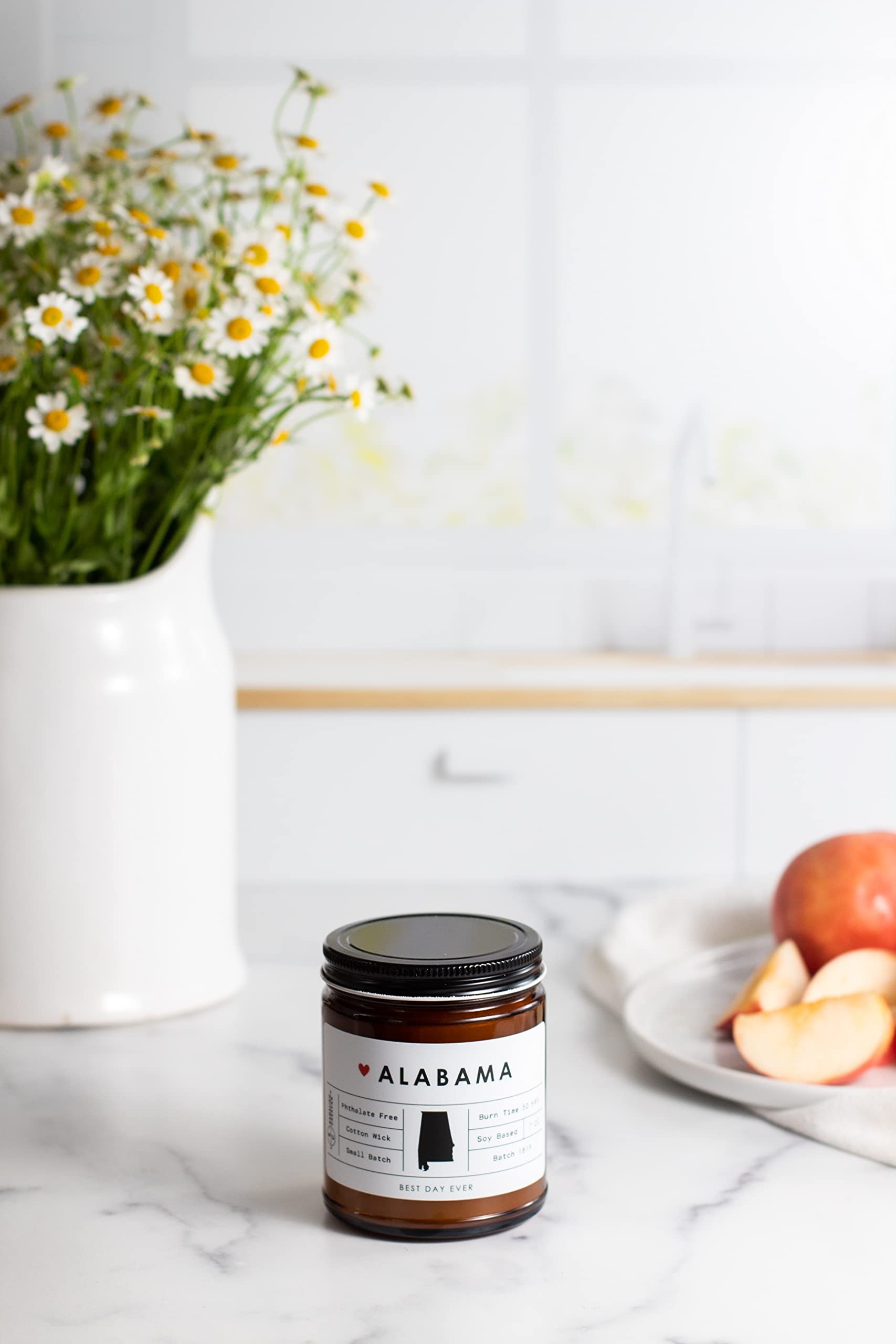 Rambling Caravan Alabama State Candle jar showcases warm wax tones for inviting spaces.