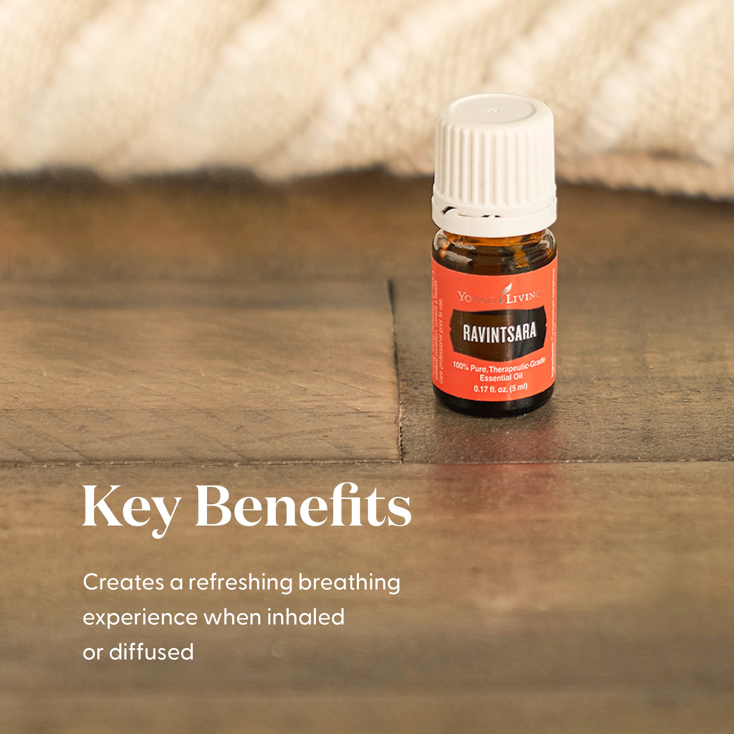 Ravintsara essential oil bottle with steam for aromatherapy use