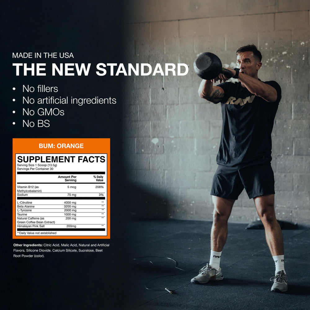 RAW Essential Pre-Workout Orange powder being mixed in water