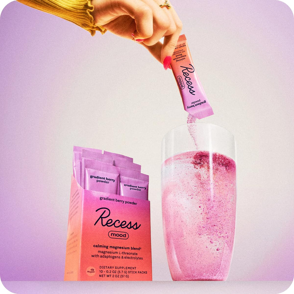 Recess Mood Powder in a glass of water with gradient berry flavor for a tasty calm drink.