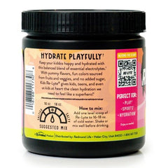Pouring pink lemonade powder into a water bottle during sport practice