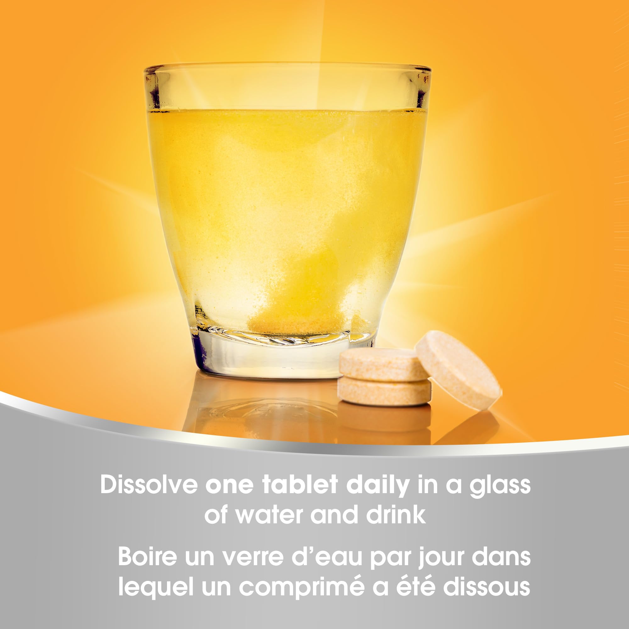 Packaging and ready glass beside Redoxon Orange bottle for travel-friendly routine