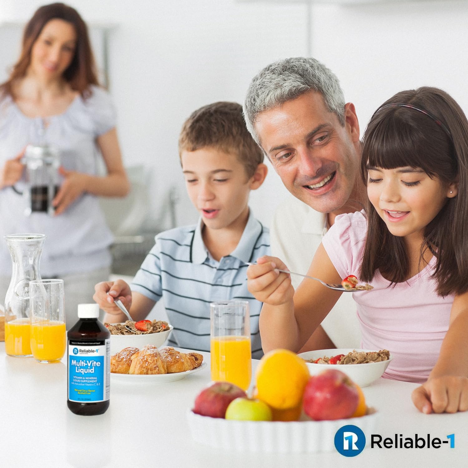 Reliable-1 Multi-Vite dosing spoon beside bottle for easy daily use