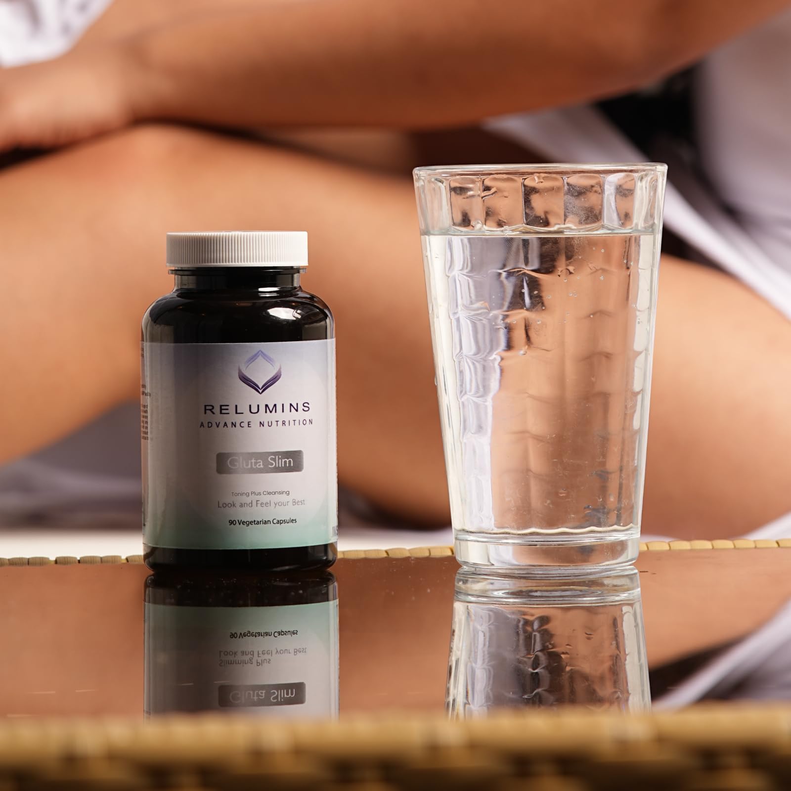 Relumins Glutathione capsules bottle side highlights compact vegan wellness routine