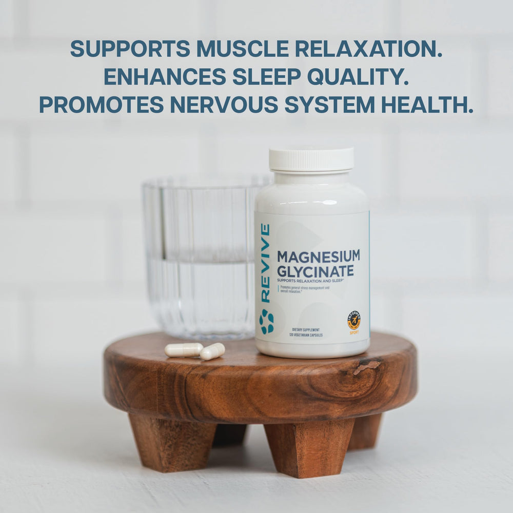 Revive MD Pure Magnesium Glycinate 200mg label close-up highlights 200mg per capsule for bone and heart support.