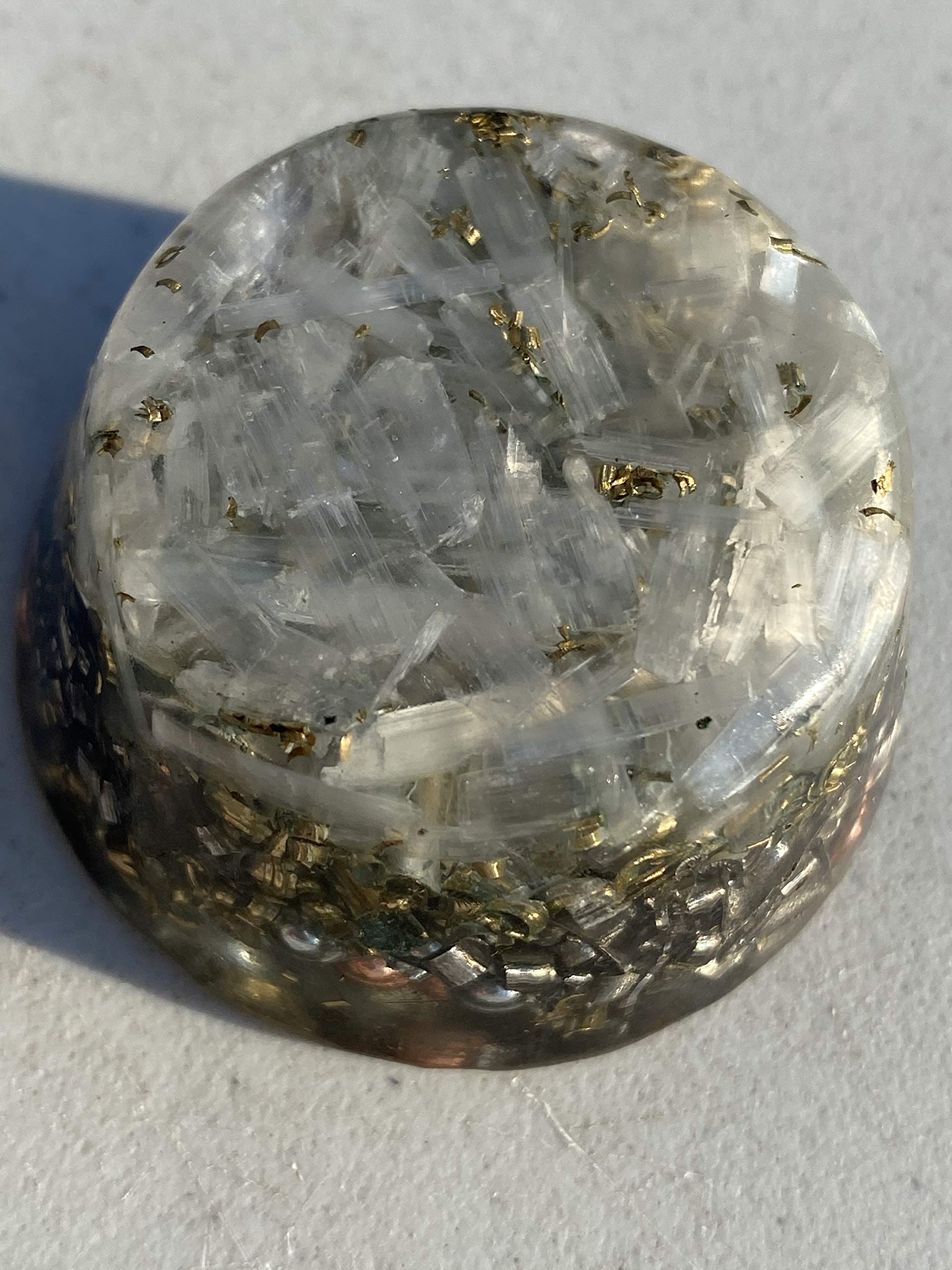 Rise Perspective Selenite Orgone Generator on desk promotes calm energy for focused work.