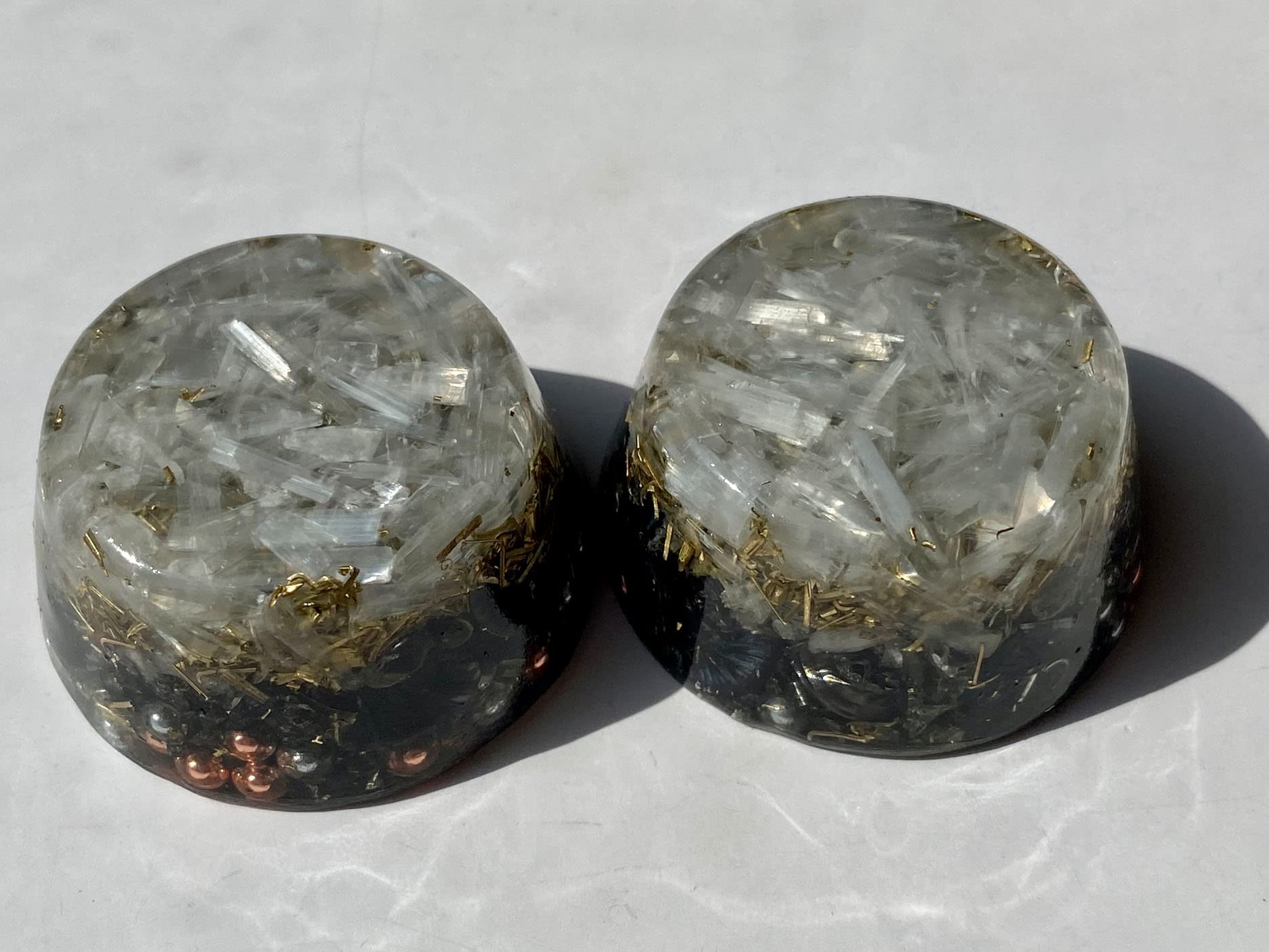 Rise Perspective Selenite Orgone Generator with plants suggests improved ambience for relaxation.