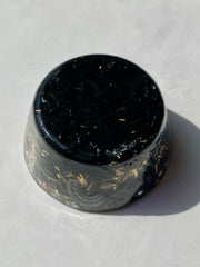 Rise Perspective Shungite Orgone Tower Buster resting on a shelf balancing energy.