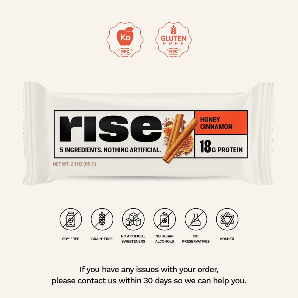 Rise Whey Bar Honey Cinnamon cross-section reveals 5 simple ingredients and creamy texture.