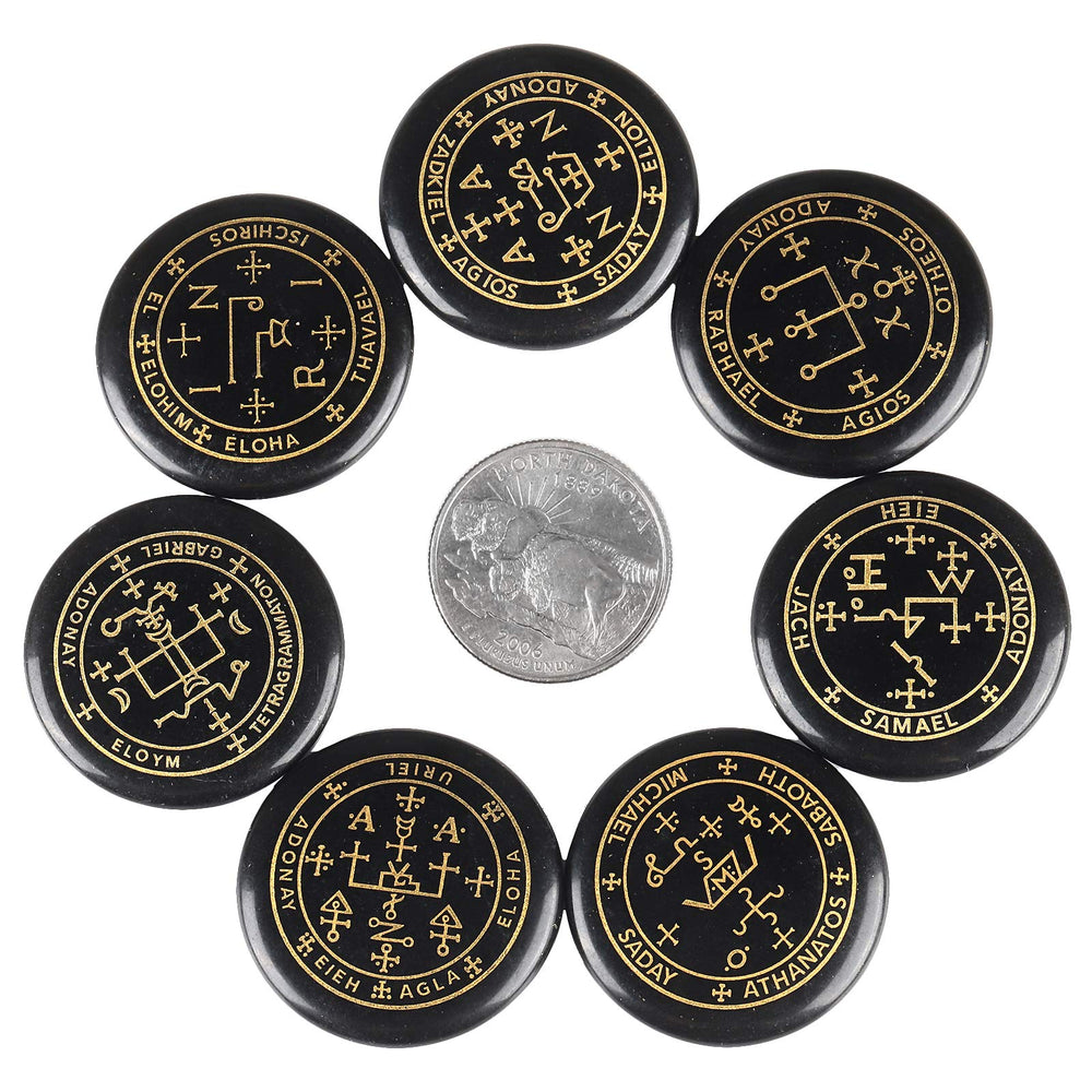 Rockcloud black agate palm stones with etched symbols for meditation.