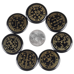 Rockcloud black agate palm stones with etched symbols for meditation.