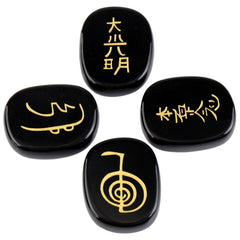 Rockcloud black agate chakra stones with engravings for mindful balance.
