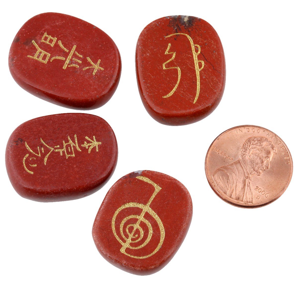 Close-up of hand-carved chakra stones for Reiki practice by Rockcloud.