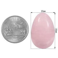 Rockcloud rose quartz pocket stone on an office desk, decorative energy and color.