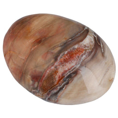 Rockcloud worry stone irregular petrified wood held in hand for calm focus
