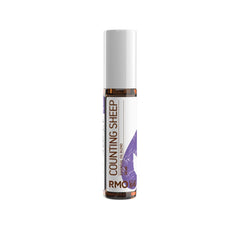 Rocky Mountain Oils Counting Sheep roller front, ideal for gentle bedtime calm.