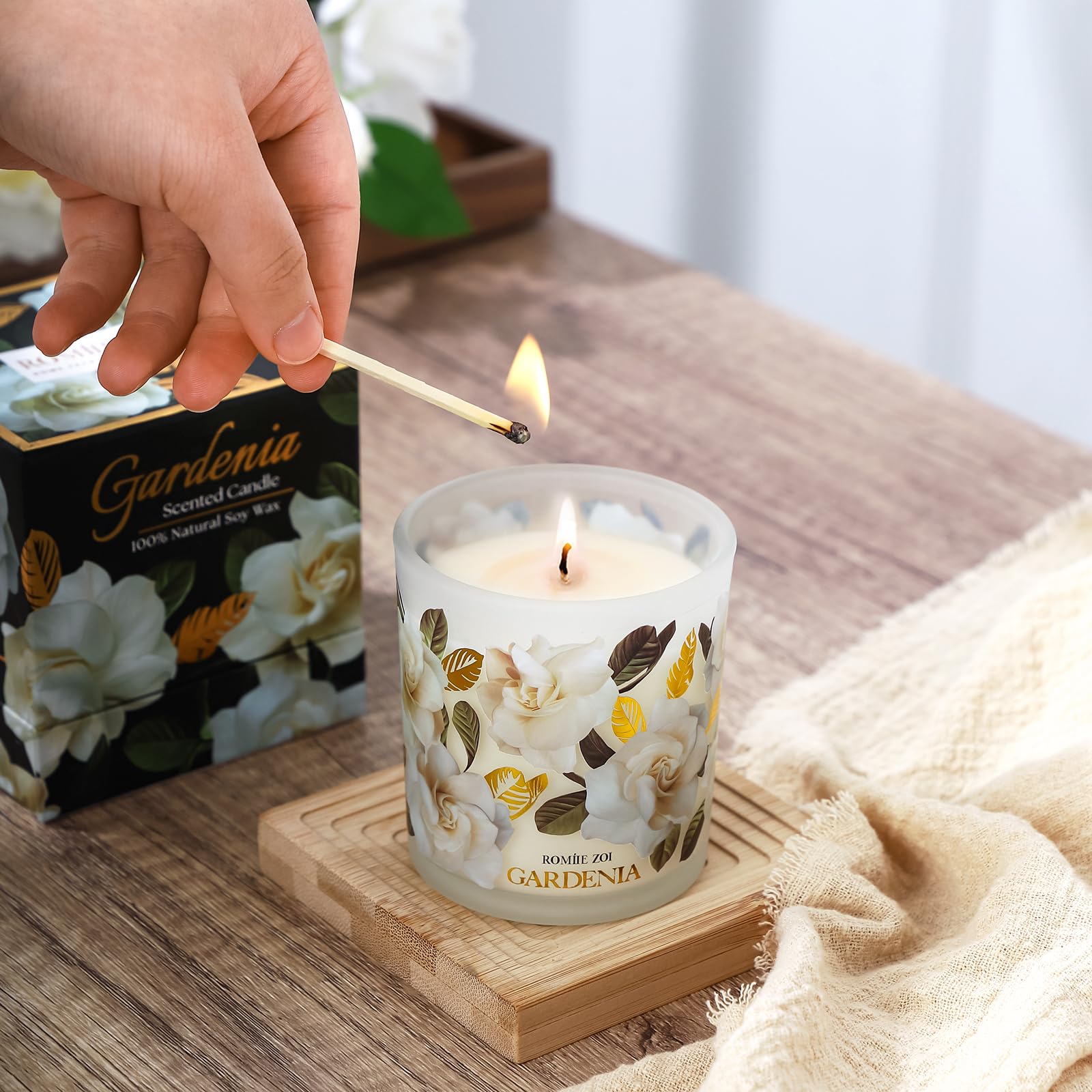 ROMIIE ZOI Gardenia candle room ambience shot in a cozy setting.