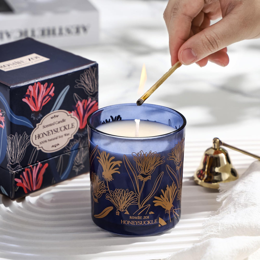 ROMIIE ZOI compact candle on a desk, boosting calm office ambiance.