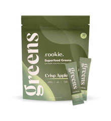 Rookie Wellness Greens bottle being poured for an energy-boosting routine