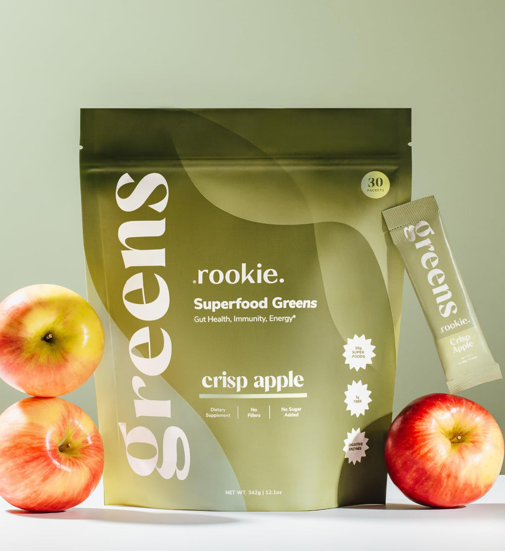 Rookie Wellness Greens powder scoop beside the tub for easy daily intake