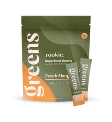 Rookie Wellness Greens powder tub with peach mango supporting daily energy and gut-friendly nutrition.