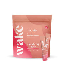 Rookie Wellness Wake scoop powder in a glass shows smooth energy without jitters.
