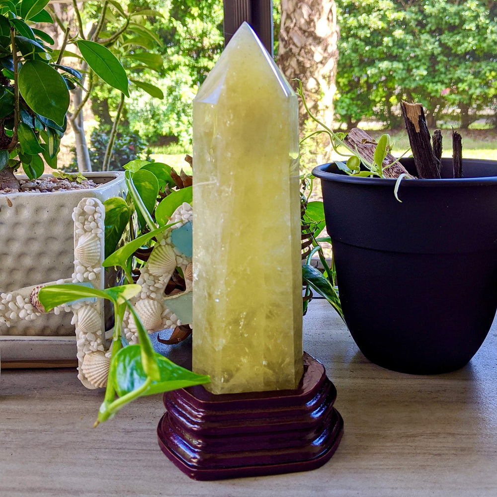 Roxxy Crystals citrine energy tower shown on desk or shelf.