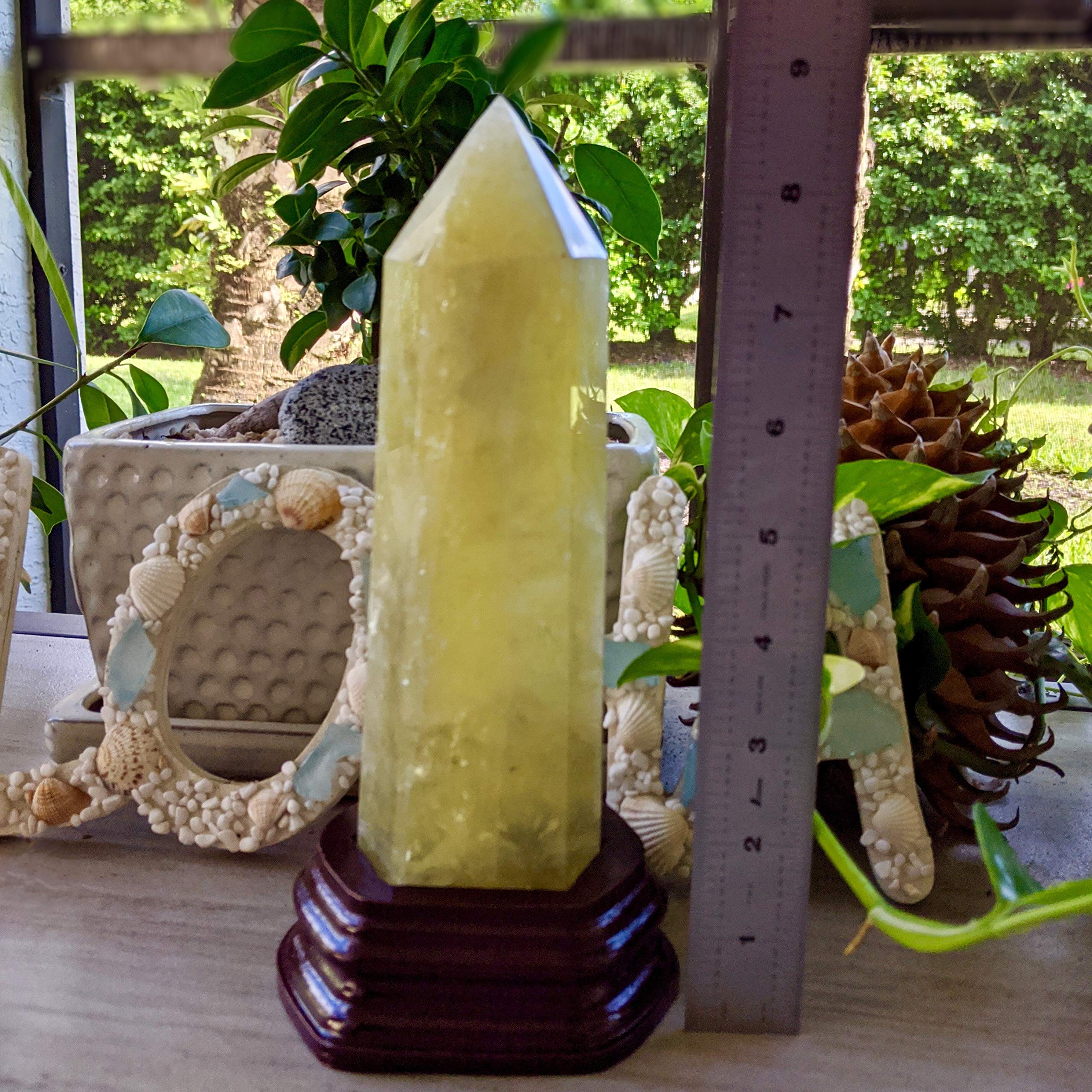 Roxxy Crystals large citrine point tower detail on display.