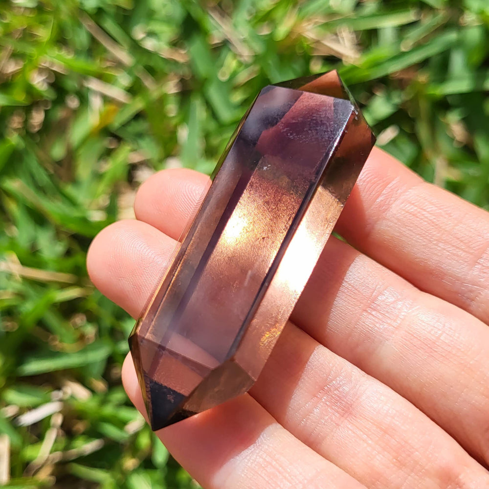 Roxxy Crystals smoky quartz double-point closeup for grounding during daily practice.