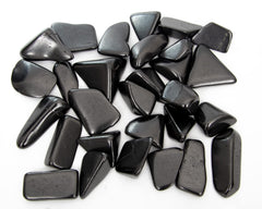 RUMINERAL shungite massage stone for calming touch.