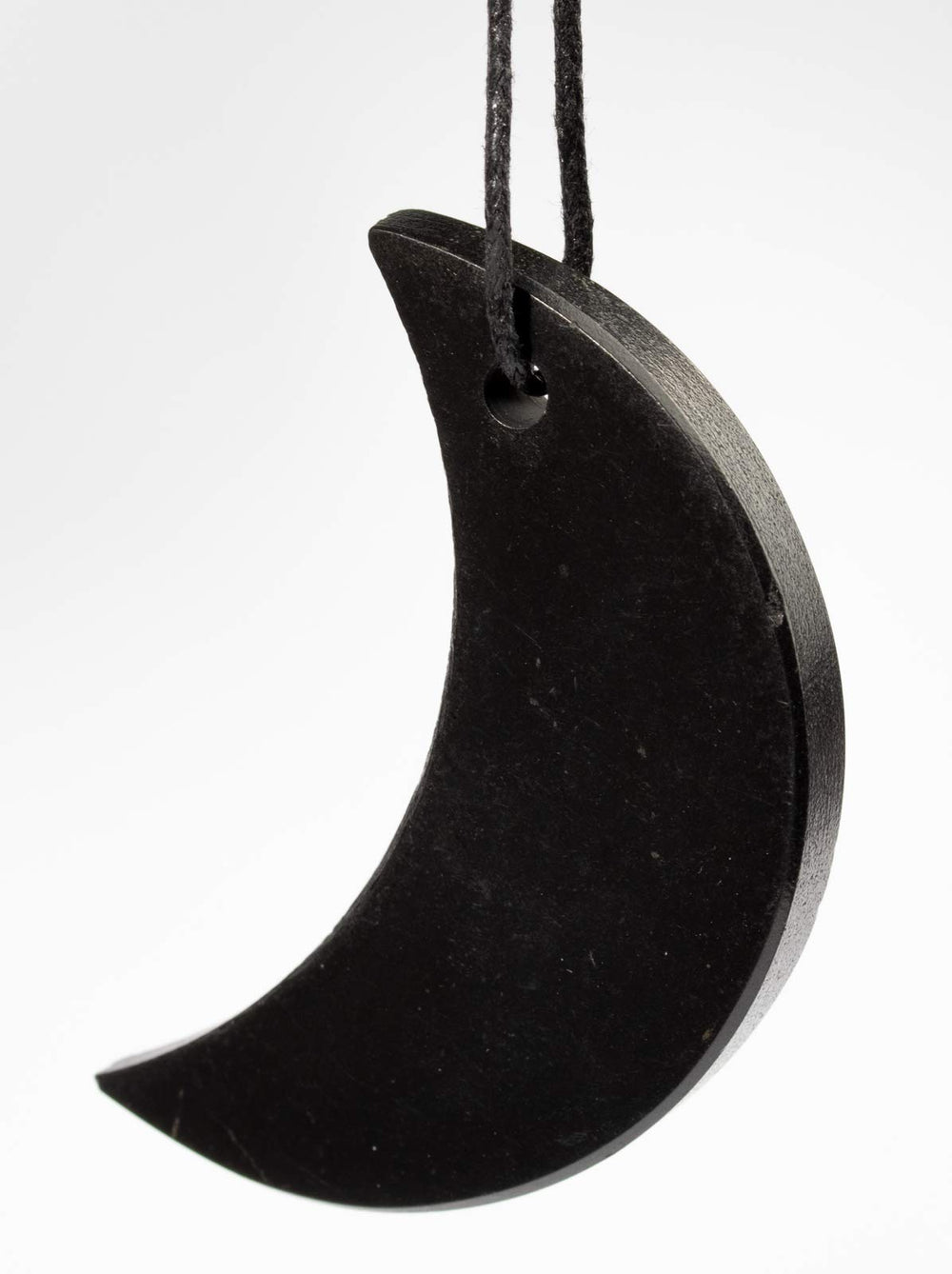RUMINERAL authentic Karelia shungite pendant in rustic half-moon design.
