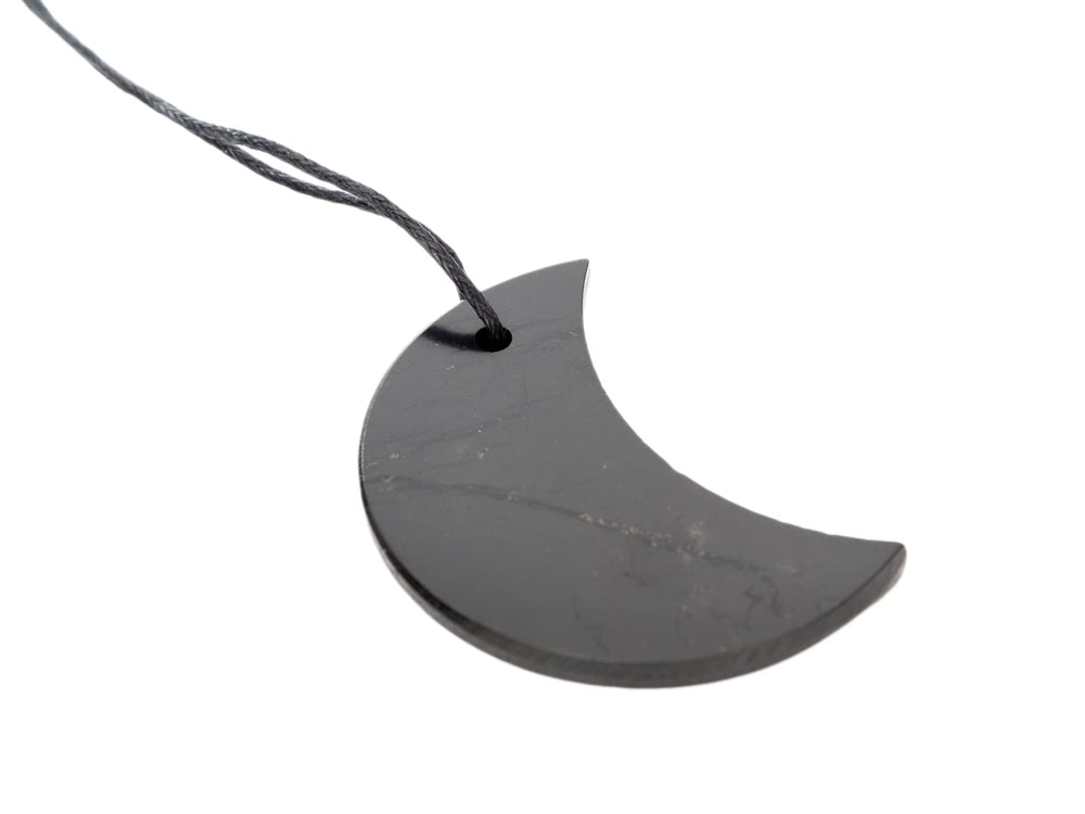 RUMINERAL two-inch Shungite pendant on cotton cord for versatile wear.
