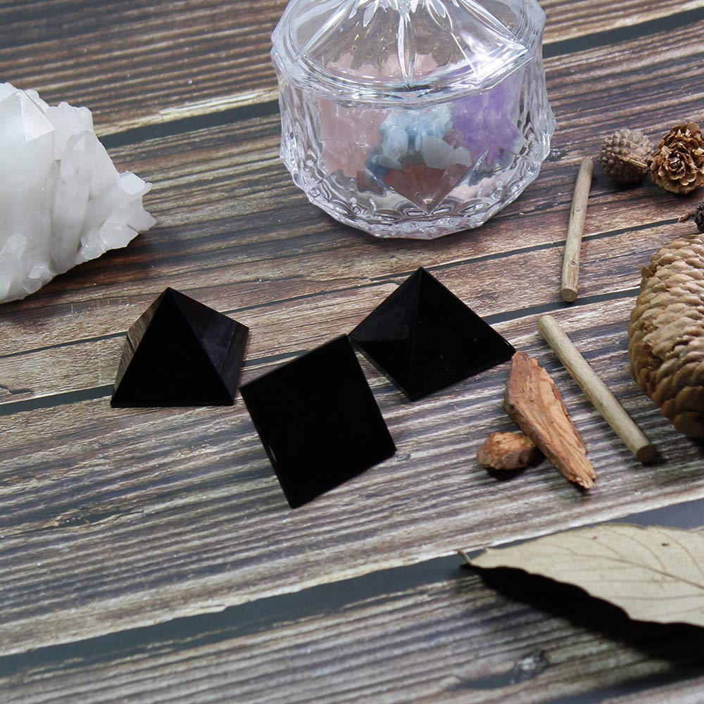 Runyangshi Black Obsidian Pyramid on a desk as a decorative focal point