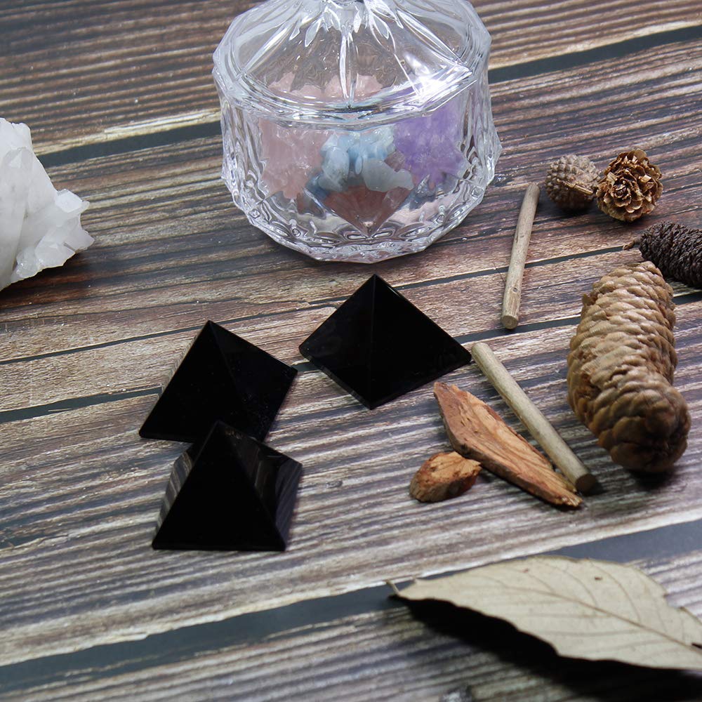 Runyangshi Black Obsidian Pyramid placed in an office setting for focus