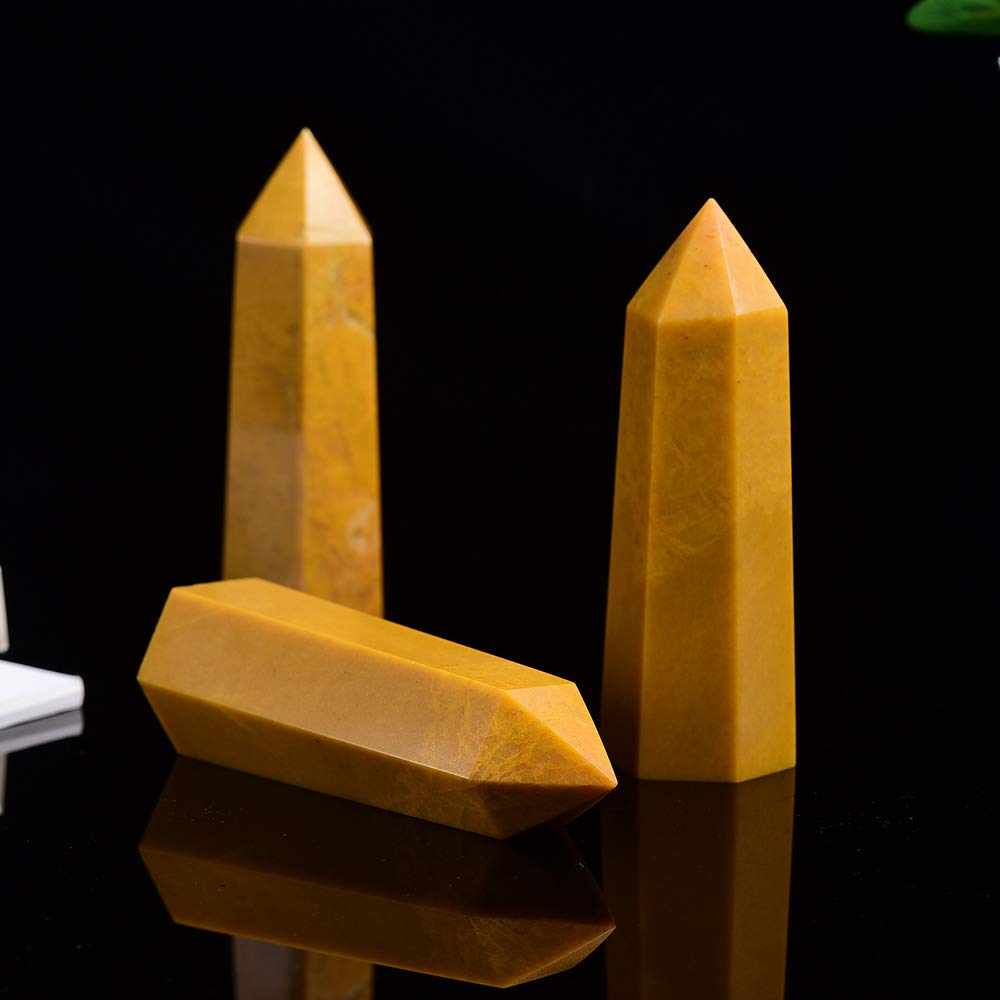 Faceted Runyangshi wand shows multiple light reflections for decorative and ritual use.