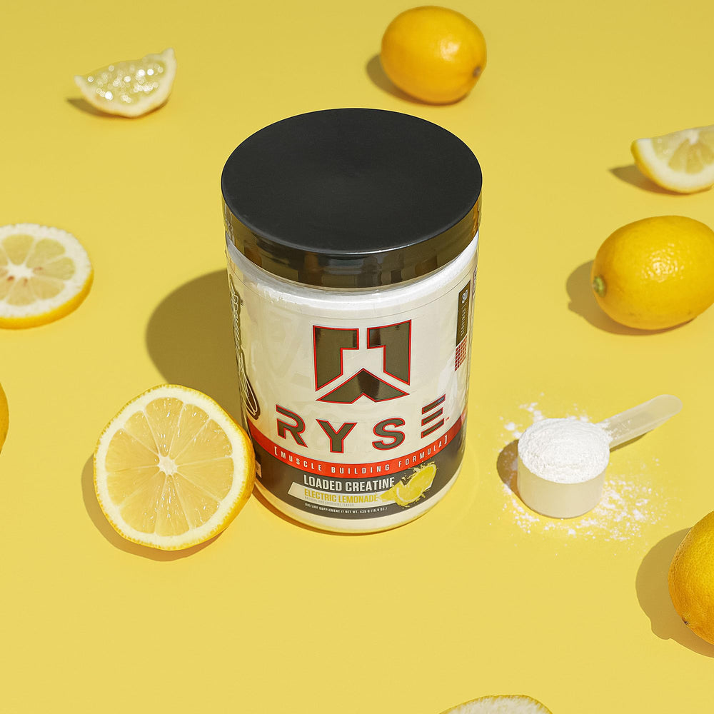 Athlete using RYSE Loaded Creatine during a gym session for strength and endurance.