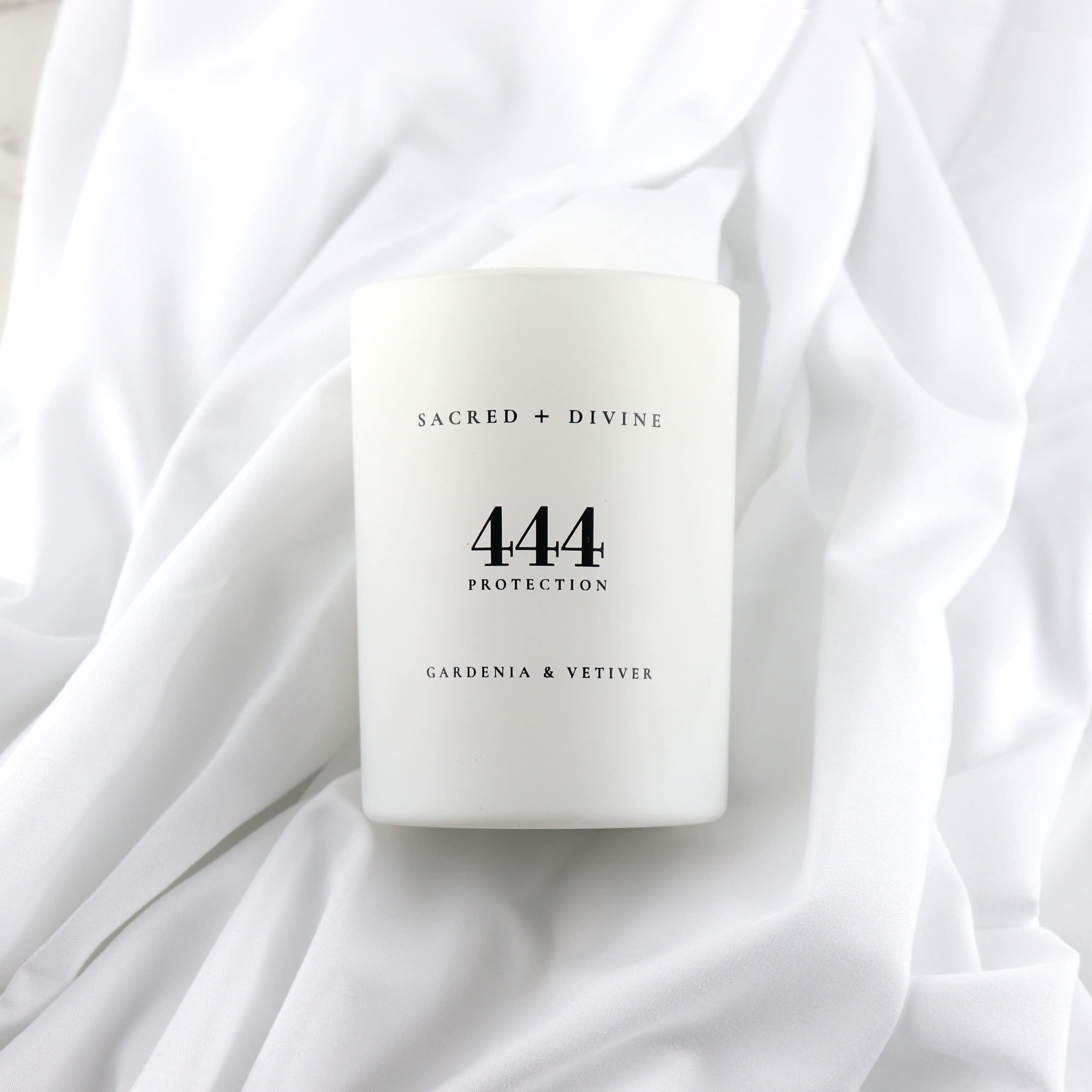 Sacred + Divine 444 minimalist white jar candle suitable for modern decor.