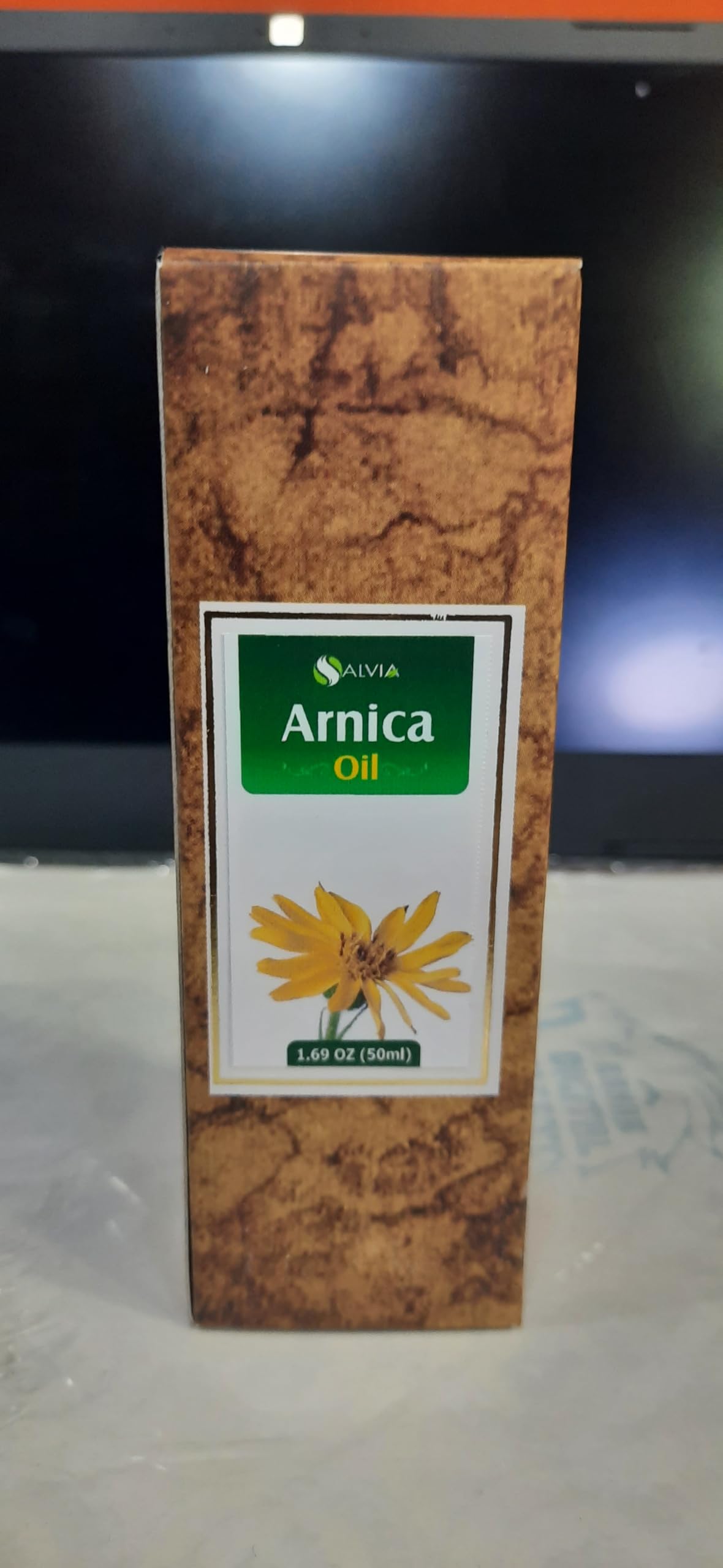 Salvia Arnica bottle label close-up showing purity.
