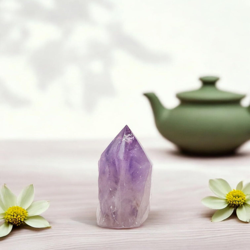 Samsari amethyst point on an altar adding tranquil ambiance.