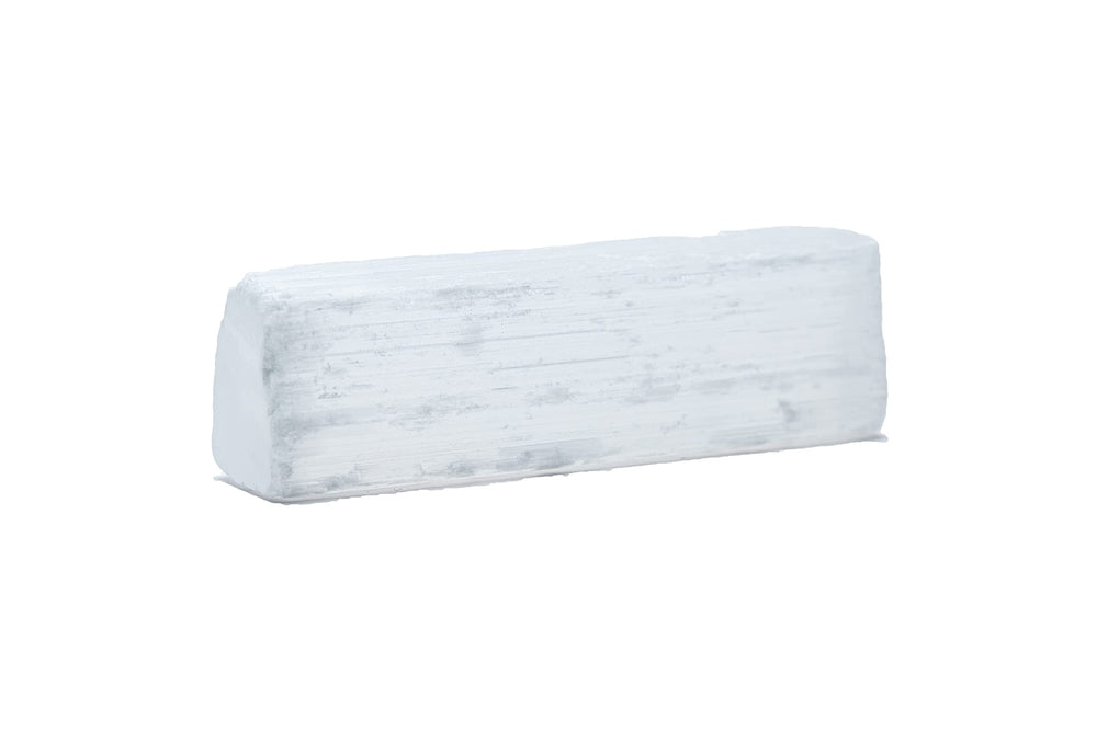 SAMSARI selenite stones held in hand for quick meditation and daily clarity.