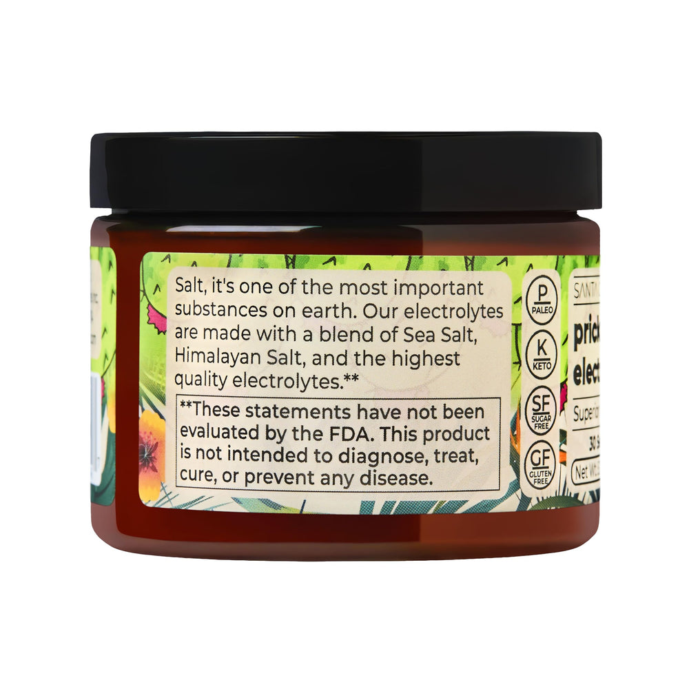 Santa Cruz Paleo Electrolyte Prickly Pear scoop in water reveals vibrant hue for outdoor hydration.