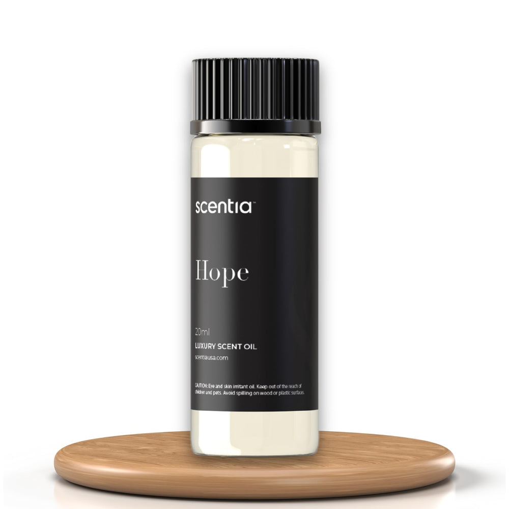 Scentia Coco-Chance oil highlights citrus and rose top notes for uplift