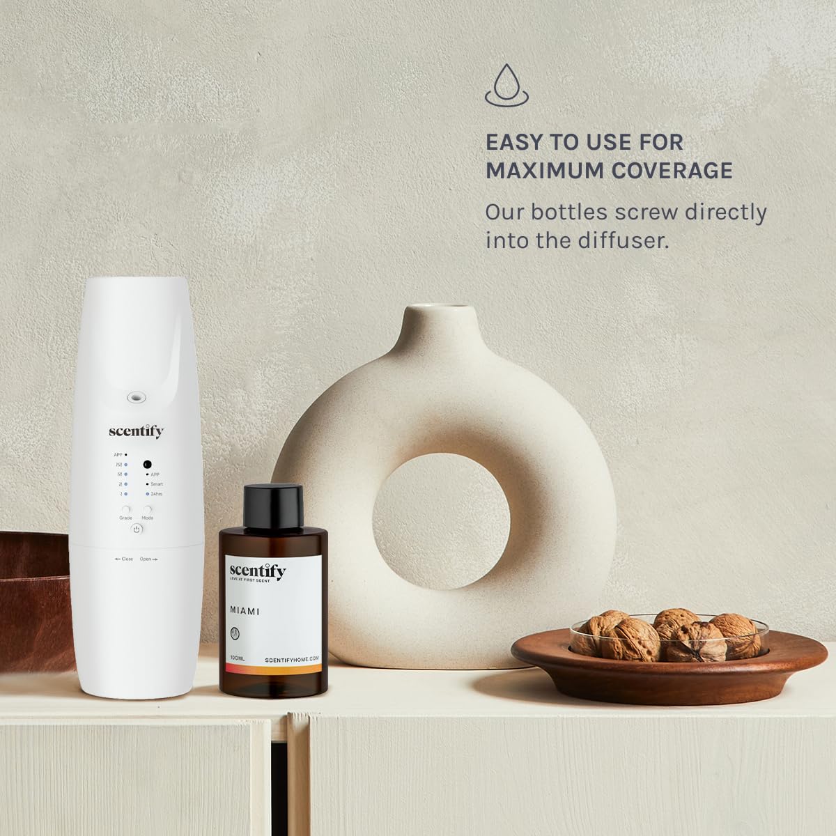 Scentify Miami aroma oil refill in a room diffuser creating a calming atmosphere.